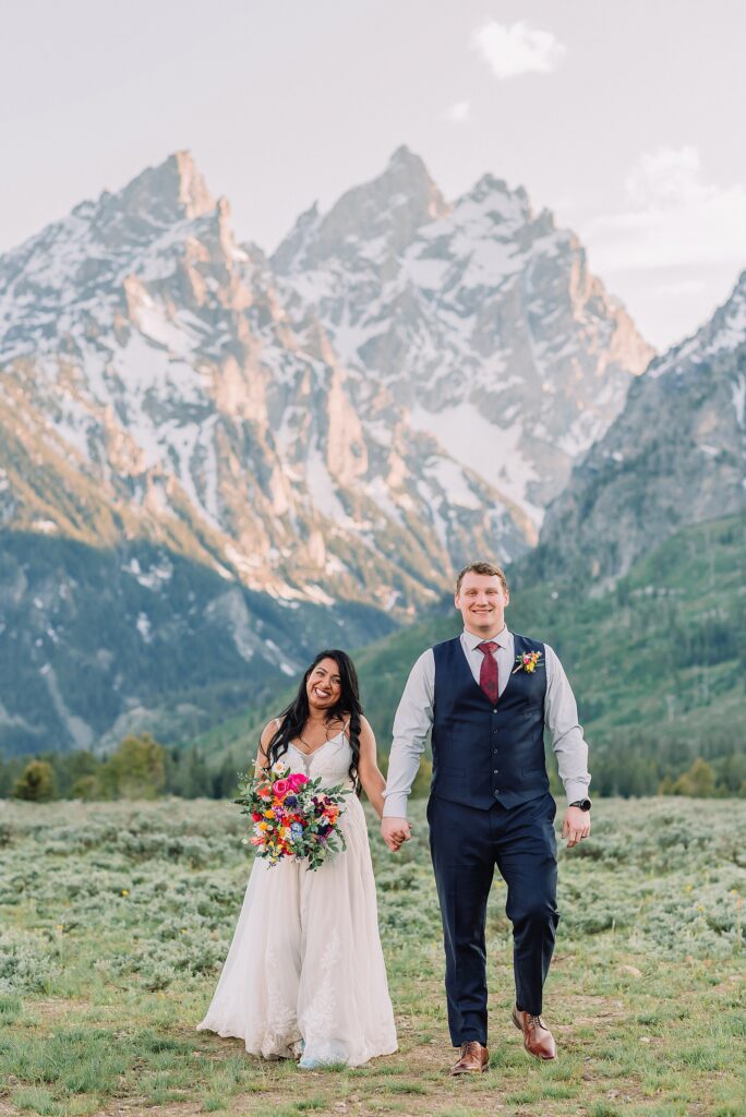 Cathedral View Turnout couple photos Grand Tetons candid elopement photography Teton Range backdrop playful elopement photos Grand Teton National Park intimate couple portraits Jackson Hole Wyoming outdoor wedding ceremony mountain backdrop photography