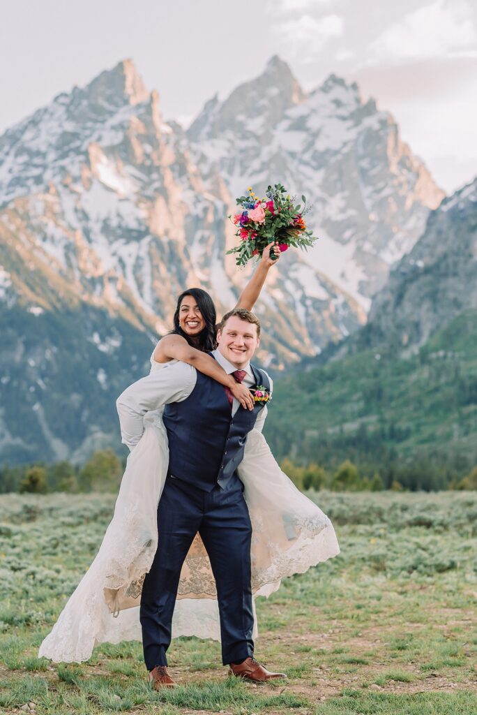 Cathedral View Turnout couple photos Grand Tetons candid elopement photography Teton Range backdrop playful elopement photos Grand Teton National Park intimate couple portraits Jackson Hole Wyoming outdoor wedding ceremony mountain backdrop photography