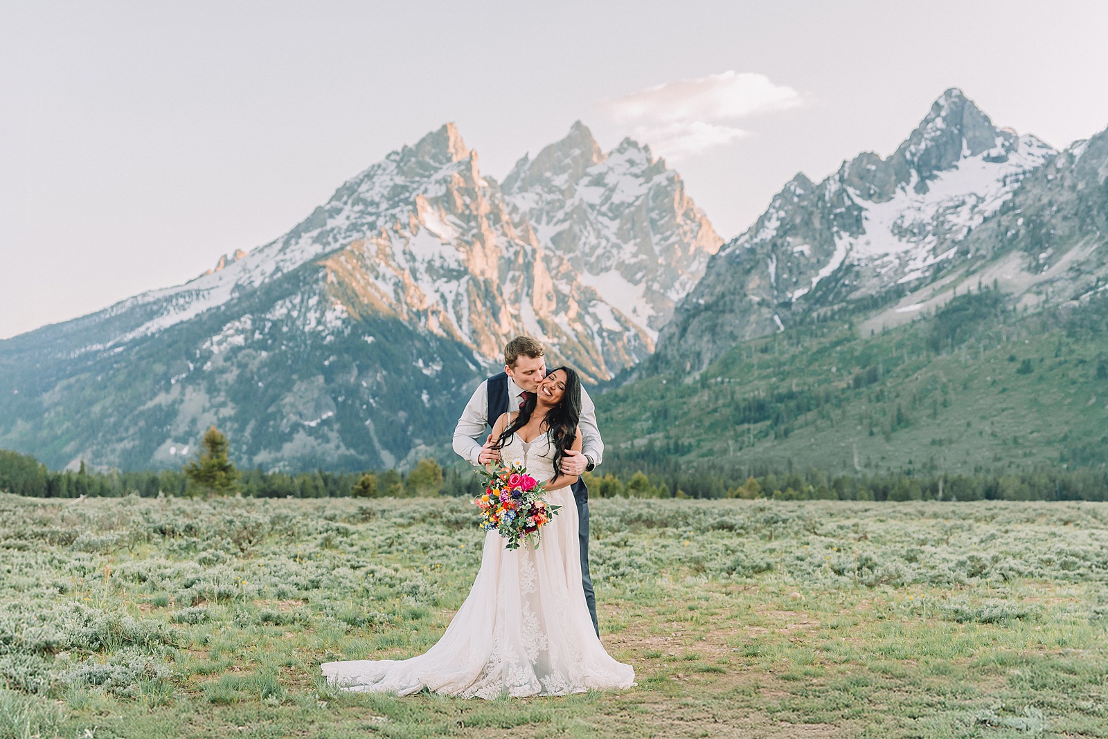 Cathedral View Turnout couple photos Grand Tetons candid elopement photography Teton Range backdrop playful elopement photos Grand Teton National Park intimate couple portraits Jackson Hole Wyoming outdoor wedding ceremony mountain backdrop photography