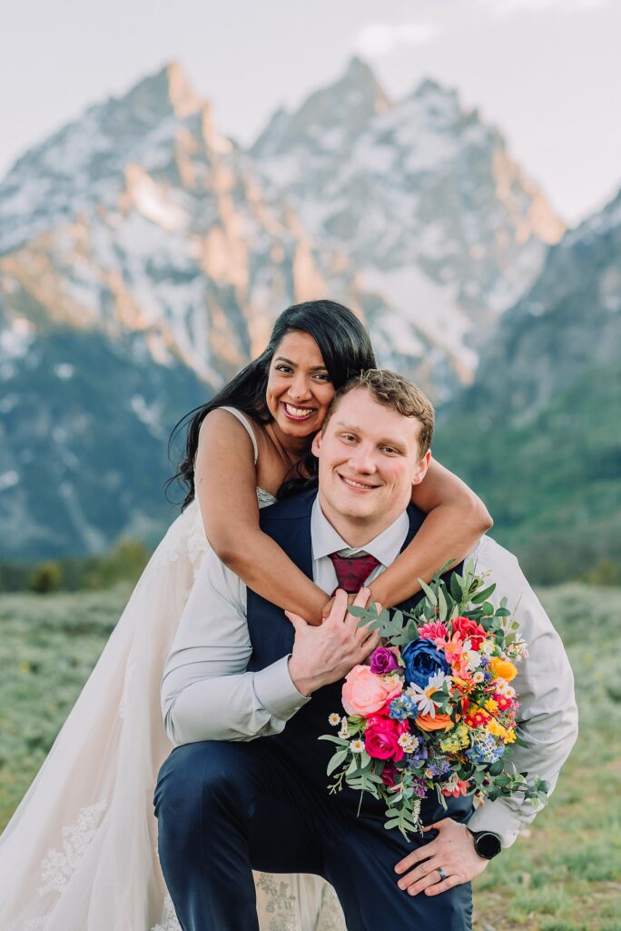 Cathedral View Turnout couple photos Grand Tetons candid elopement photography Teton Range backdrop playful elopement photos Grand Teton National Park intimate couple portraits Jackson Hole Wyoming outdoor wedding ceremony mountain backdrop photography