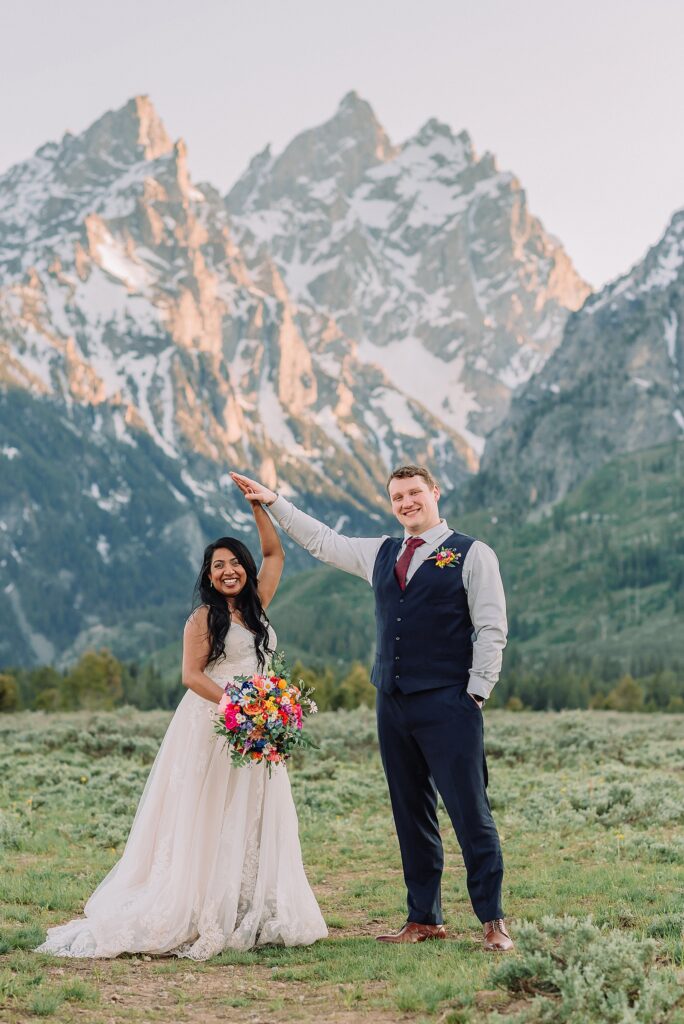 Cathedral View Turnout couple photos Grand Tetons candid elopement photography Teton Range backdrop playful elopement photos Grand Teton National Park intimate couple portraits Jackson Hole Wyoming outdoor wedding ceremony mountain backdrop photography