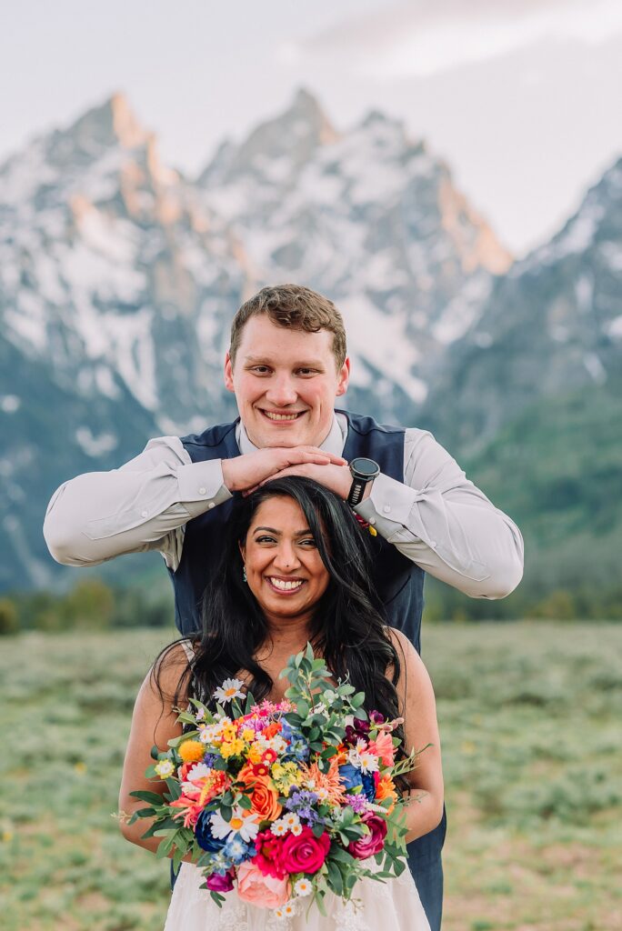 Cathedral View Turnout couple photos Grand Tetons candid elopement photography Teton Range backdrop playful elopement photos Grand Teton National Park intimate couple portraits Jackson Hole Wyoming outdoor wedding ceremony mountain backdrop photography