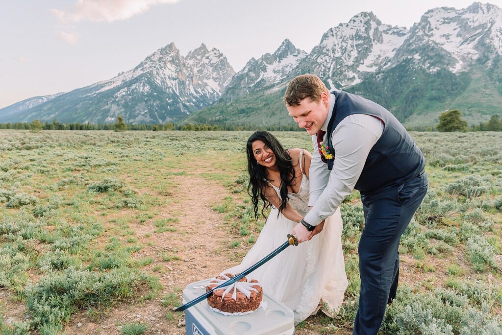 Cathedral View Turnout couple photos Grand Tetons candid elopement photography Teton Range backdrop playful elopement photos Grand Teton National Park intimate couple portraits Jackson Hole Wyoming outdoor wedding ceremony mountain backdrop photography