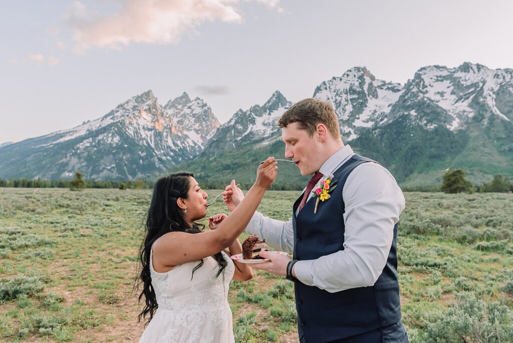 Cathedral View Turnout couple photos Grand Tetons candid elopement photography Teton Range backdrop playful elopement photos Grand Teton National Park intimate couple portraits Jackson Hole Wyoming outdoor wedding ceremony mountain backdrop photography