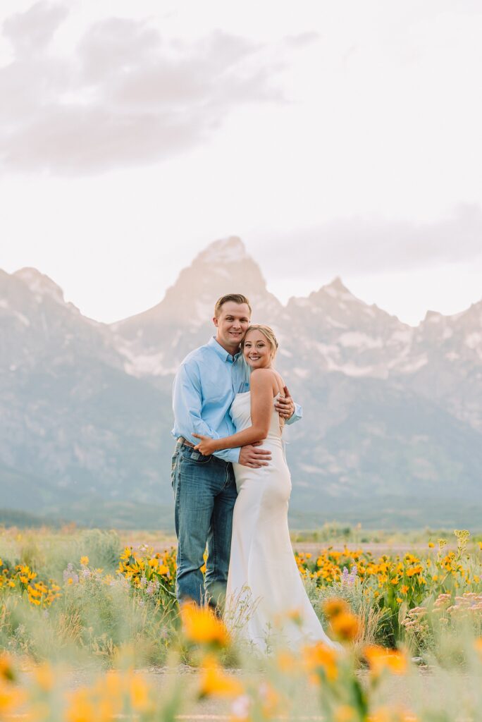Blacktail Butte wildflower elopement session Grand Teton National Park intimate wedding photography Wyoming mountain elopement with children Summer Grand Teton elopement pictures June Wedding with wildflowers