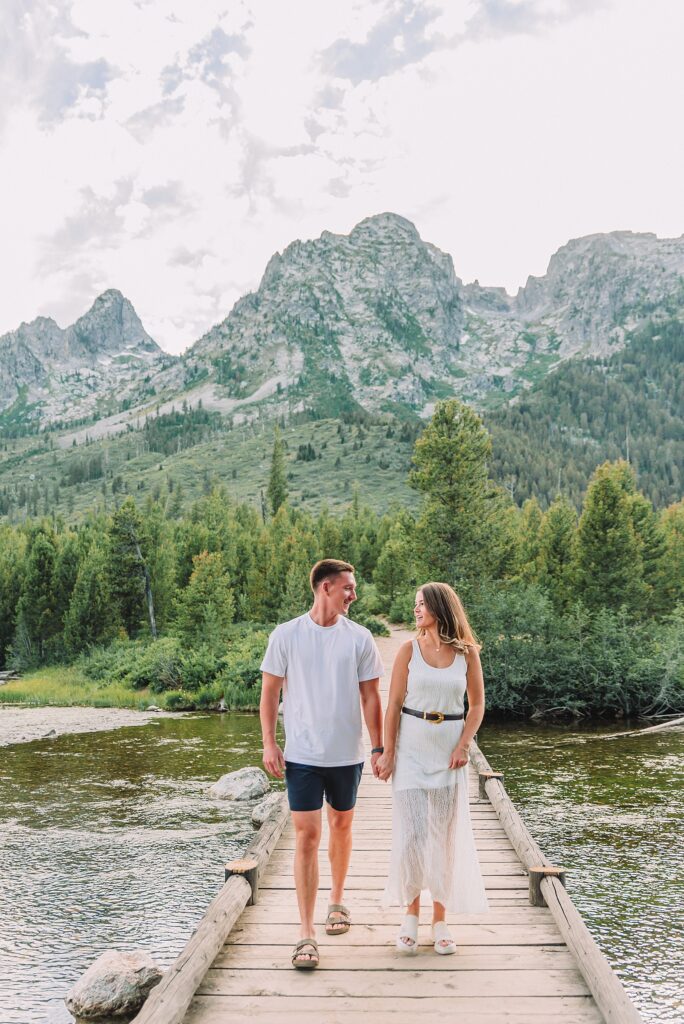 Jackson Hole Photographer Tetons engagement photos at String Lake Grand Teton National Park engagement session String Lake engagement photography Wyoming mountain engagement photos wooden bridge