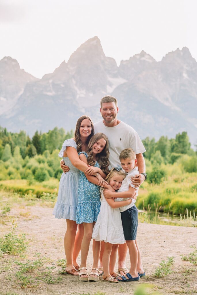 Schwabacher Landing family photos summer Grand Teton National Park family photographer what to wear for mountain family photos blue and white family photo outfits summer family session Jackson Hole