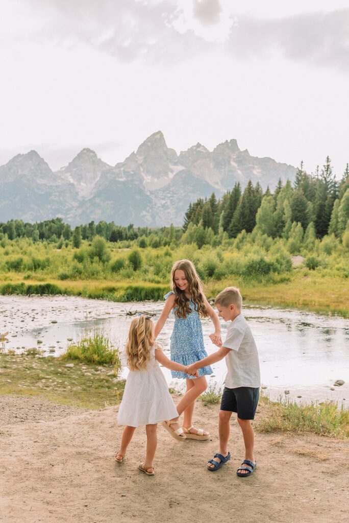 summer family session Jackson Hole Teton mountain backdrop family portraits coordinating family outfits without matching Grand Teton vacation photographer