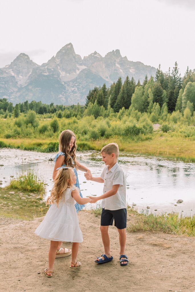 summer family session Jackson Hole Teton mountain backdrop family portraits coordinating family outfits without matching Grand Teton vacation photographer