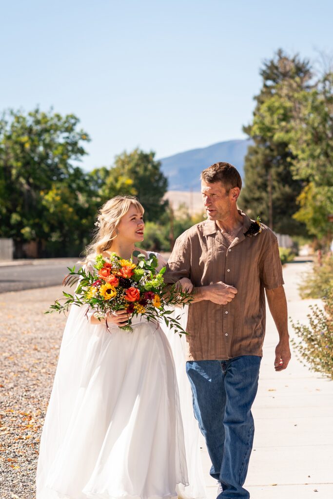 backyard elopement to wedding celebration handmade wedding arch ceremony photography Utah Wedding Photographer small town Utah wedding celebration