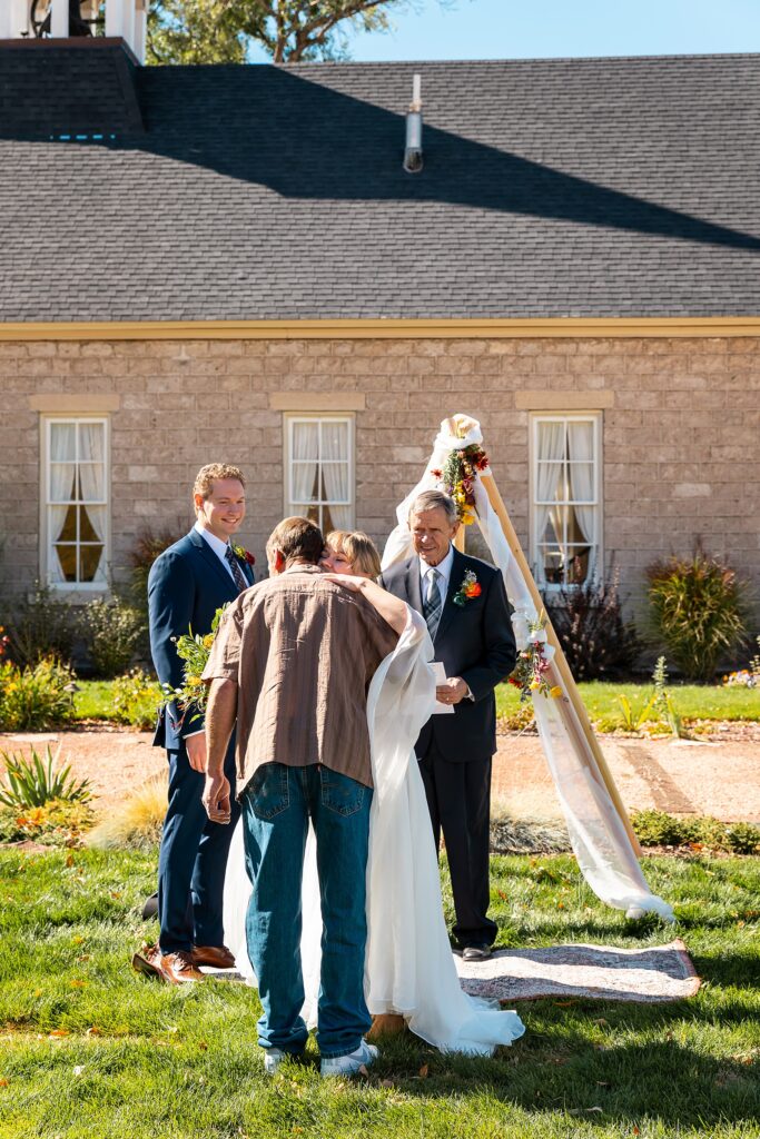 backyard elopement to wedding celebration handmade wedding arch ceremony photography Utah Wedding Photographer small town Utah wedding celebration
