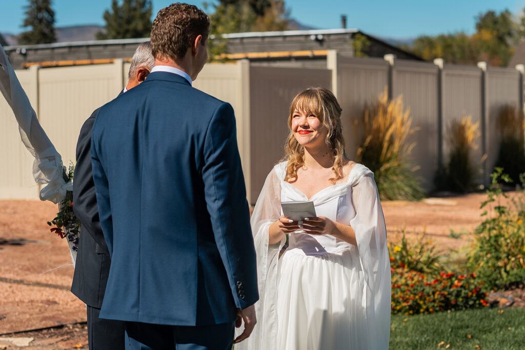 backyard elopement to wedding celebration handmade wedding arch ceremony photography Utah Wedding Photographer small town Utah wedding celebration