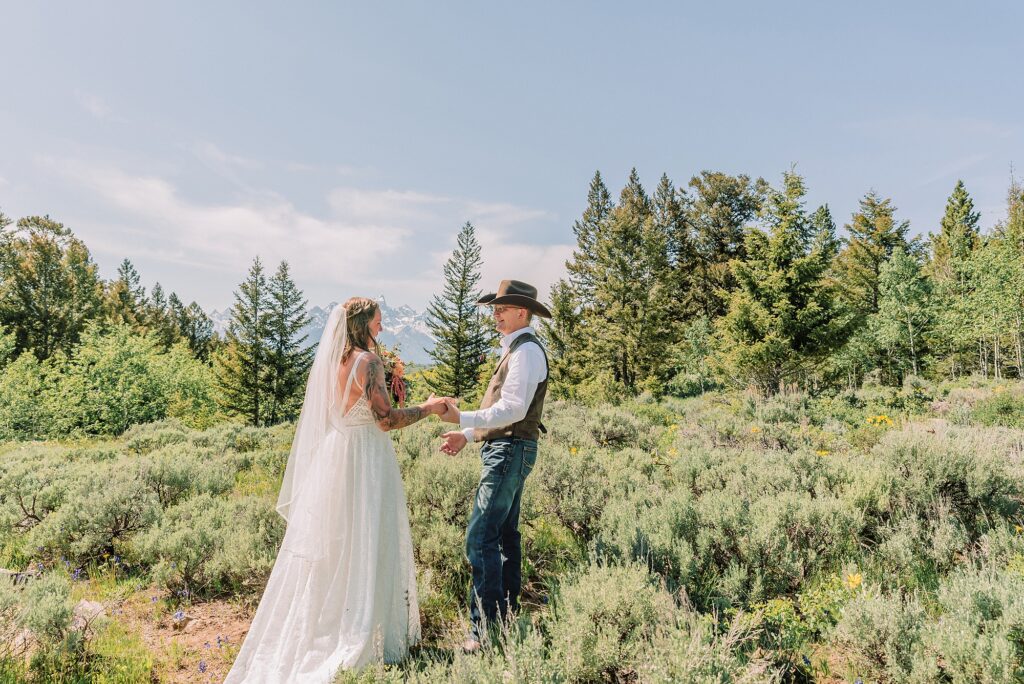 Wyoming wedding photographer Grand Teton National Park ceremony The Wedding Tree Bridger-Teton National Forest wedding photos Bride first look with dad Wyoming mountain wedding Yellow wildflower wedding photos Jackson Hole Wyoming Jackson Hole wedding photographer