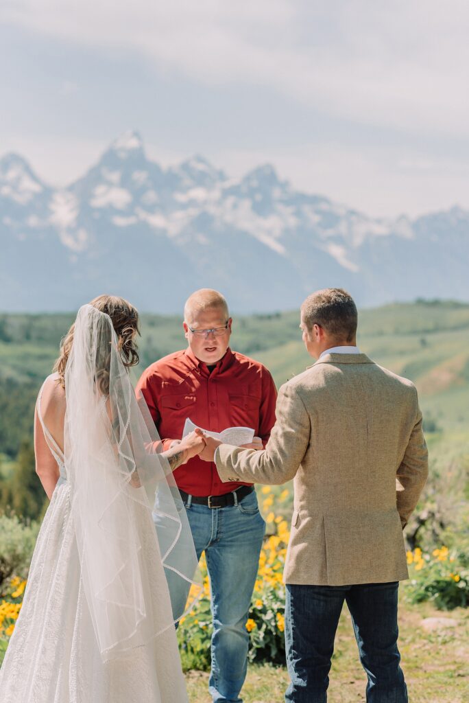 Wyoming wedding photographer Grand Teton National Park ceremony The Wedding Tree Bridger-Teton National Forest wedding photos Wyoming mountain wedding photographer Yellow wildflower wedding photos Jackson Hole Wyoming Jackson Hole wedding photographer