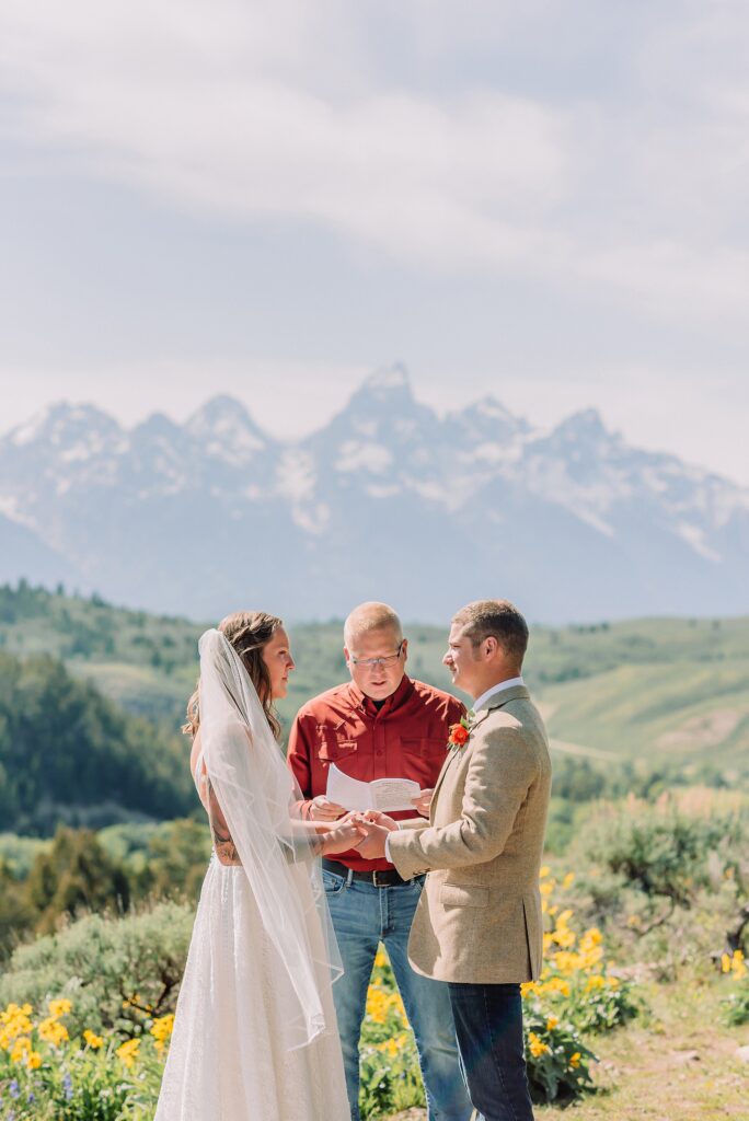 Wyoming wedding photographer Grand Teton National Park ceremony The Wedding Tree Bridger-Teton National Forest wedding photos Wyoming mountain wedding photographer Yellow wildflower wedding photos Jackson Hole Wyoming Jackson Hole wedding photographer