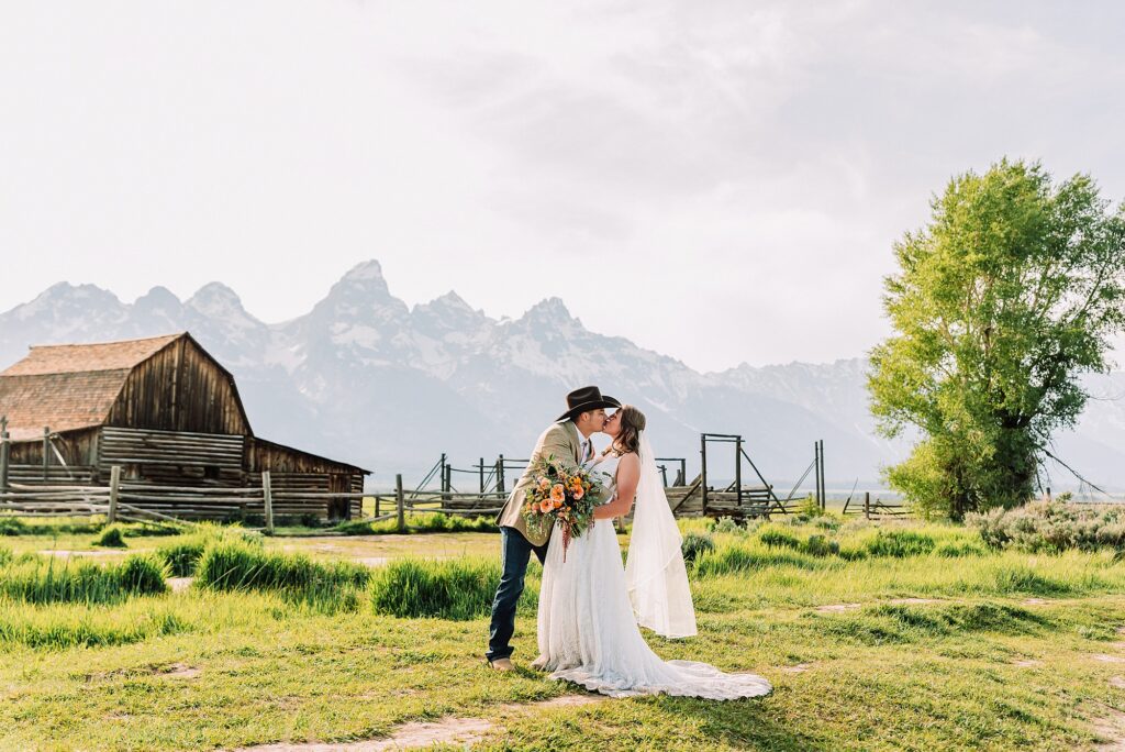 Jackson Hole Wyoming wedding photography Jackson Hole wedding photography Mormon Row portraits Bride fringed jean jacket Western wedding style Mormon Row Rustic Barn Wedding