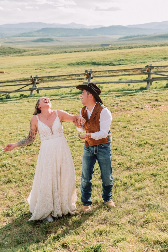 Rustic Wyoming outdoor wedding reception dance floor Faith-based knot tying wedding ceremony Wyoming Candid hilarious cake cutting wedding photos Two-day Wyoming wedding ceremony and reception photography destination Wyoming wedding photography